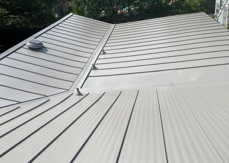Solar attic fan installed on a metal roof for Roof Ventilation in Redmond